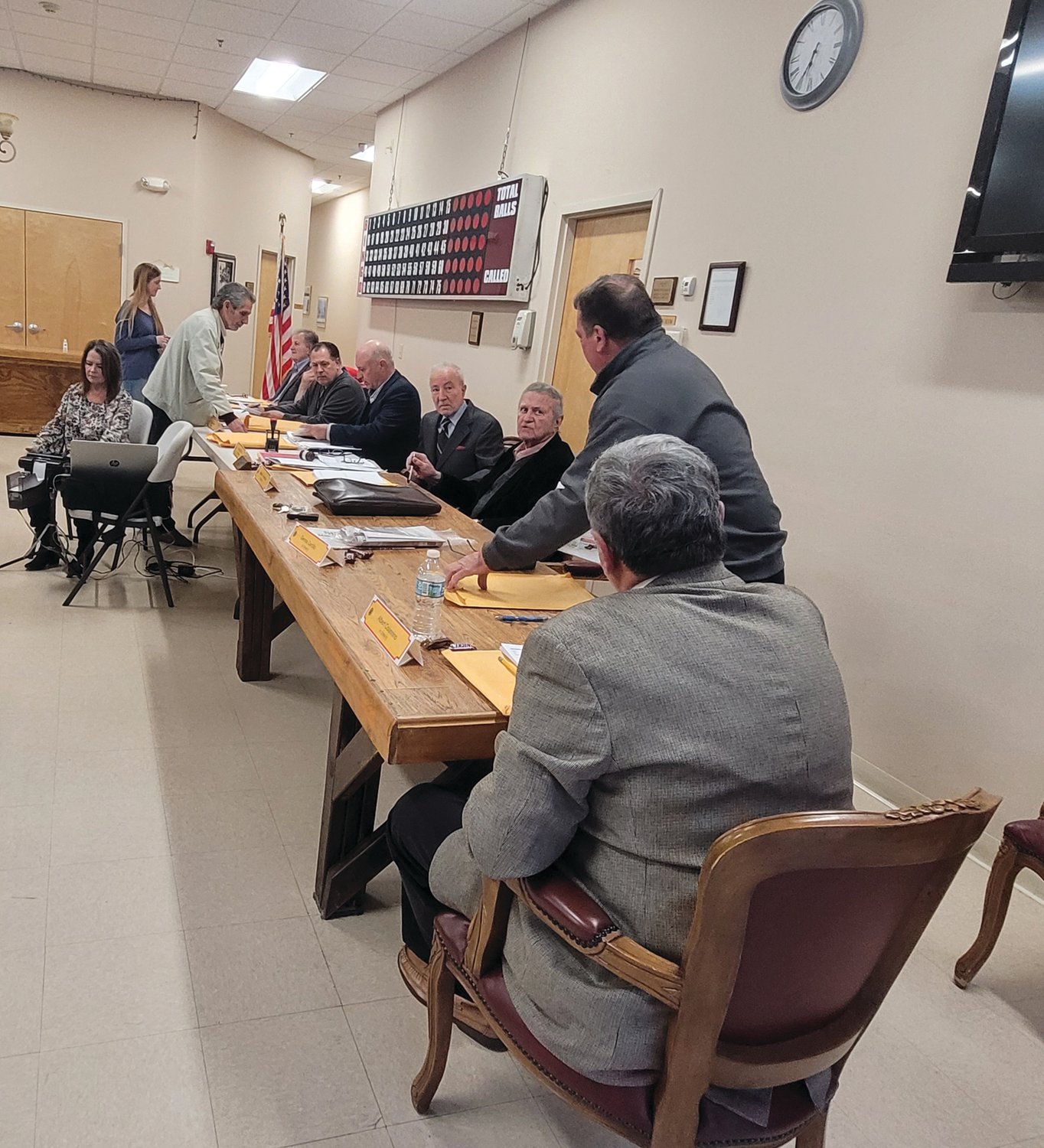 SPEAK SOFTLY: The audience started Thursday’s meeting with audible hostility. The Zoning Board spoke from a long table at one end of the Senior Center’s main activity room. They spoke quietly, and there were no microphones.